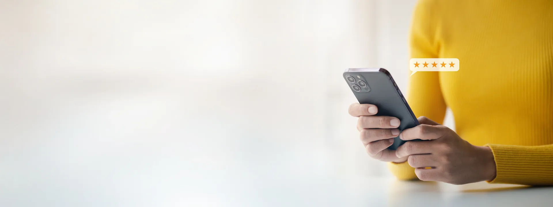 Business owner managing 5-star Google reviews on smartphone.